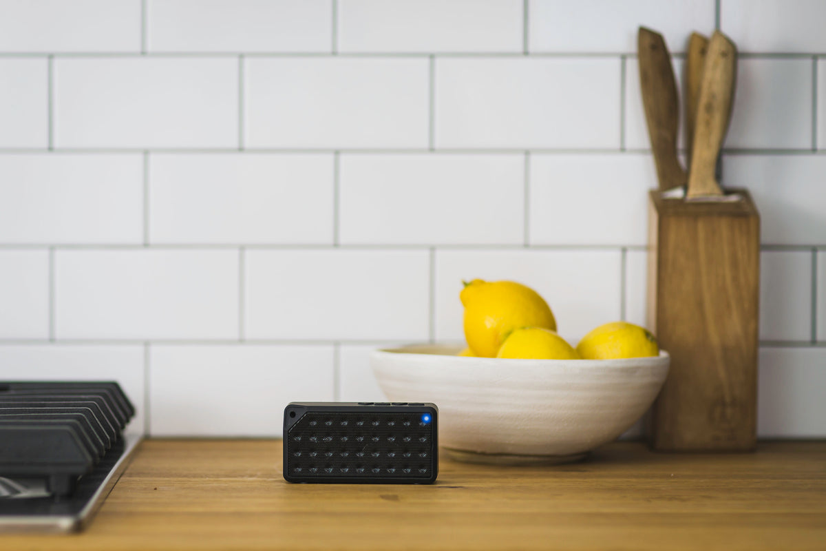 EIZA BeatBox portable bluetooth speaker on a kitchen counter